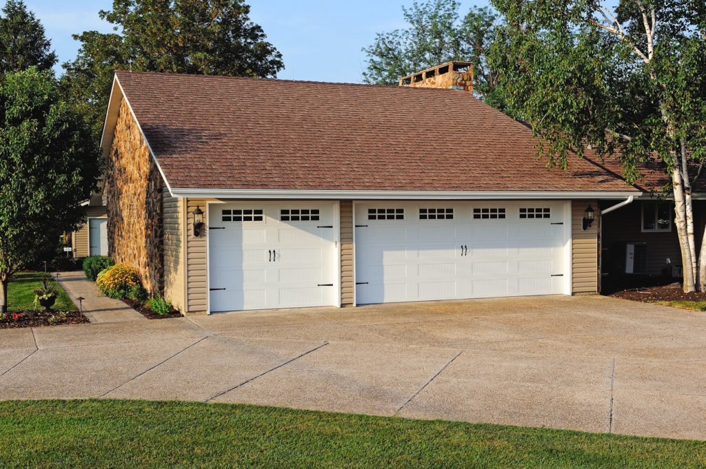 Stamped Carriage House Long shown in White with optional Plain glass, Stockton window inserts and Spade hardware