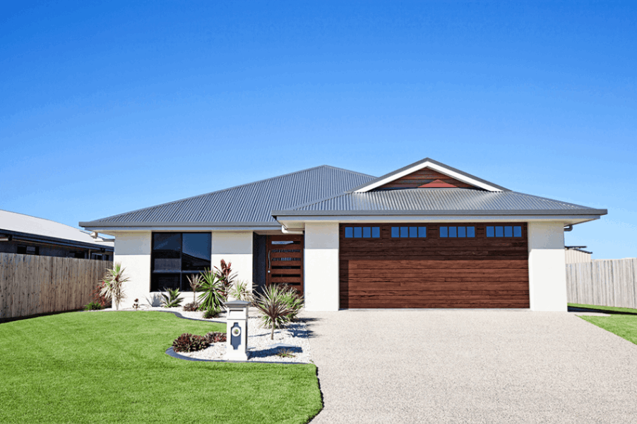 modern home with wood accent garage on a hot summer day