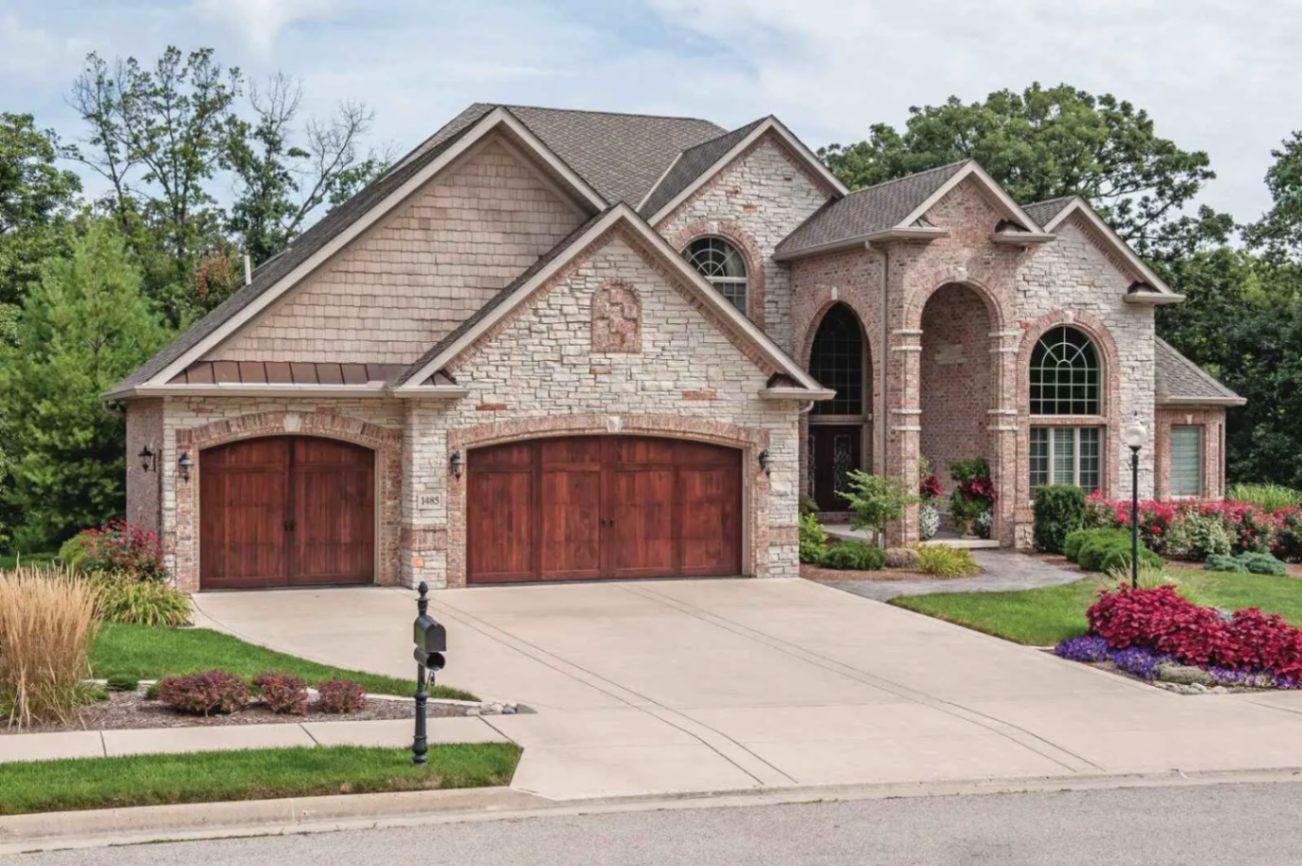 Overlay Carriage House Wood shown in Cedar with Wrought Iron hardware.