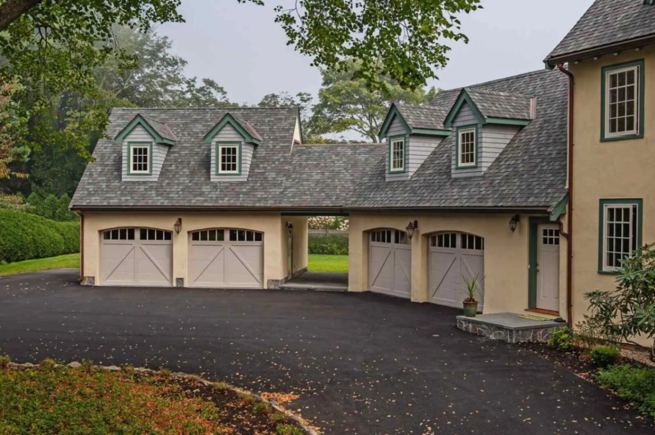 Overlay Carriage House Steel shown in Sandstone with optional Arched Madison windows.