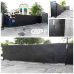 Rolling commercial gate for dumpster access with locks and side entry door