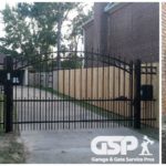 finished installation of a residential gate system with gate, gate opener and entry door