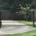 decorative driveway gate with side door opening