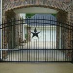 decorative driveway gate with Texas star